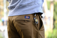 detail of the rear pocketing of the tracko collab work pant in coyote