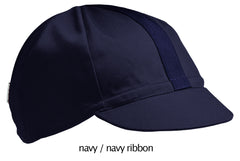flat shot of our navy 4 panel cotton cap with navy ribbon