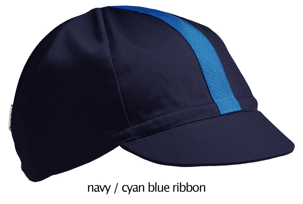 flat shot of our navy 4 panel cotton cap with cyan ribbon