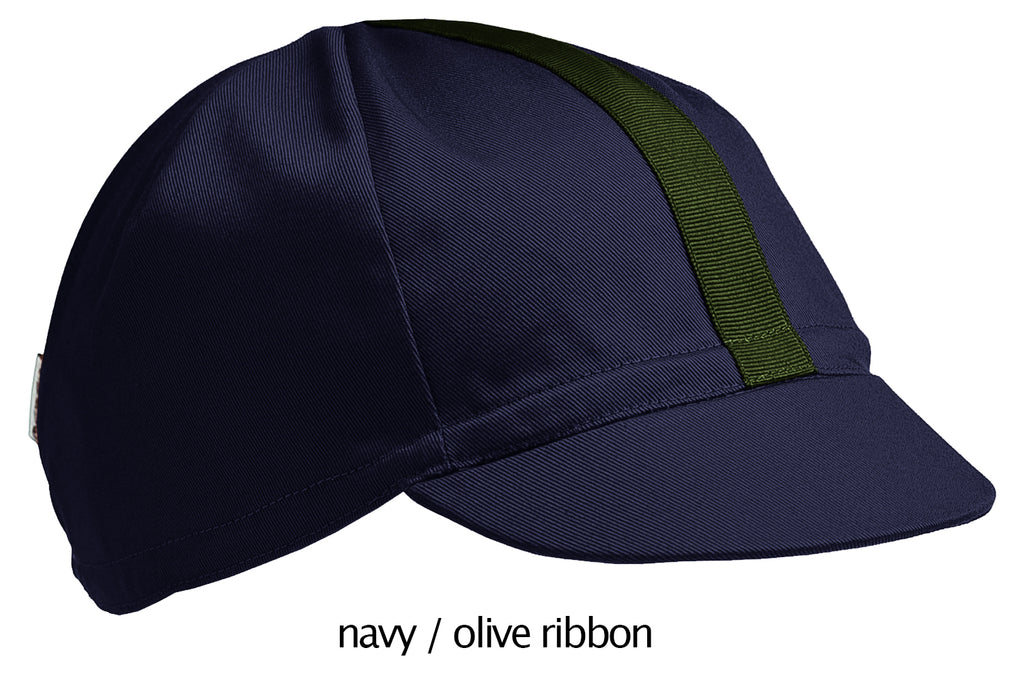 flat shot of our navy 4 panel cotton cap with olive ribbon