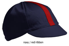 flat shot of our navy 4 panel cotton cap with red ribbon