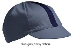 flat shot of the 4-panel cotton cap in blue-grey with a navy ribbon