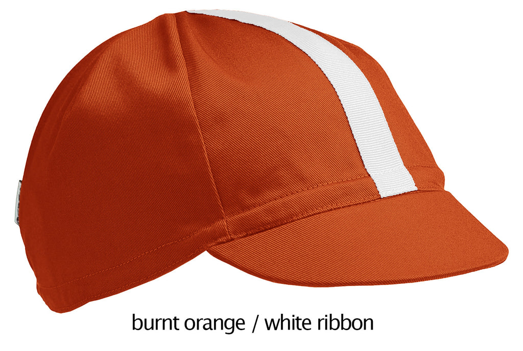 flat shot of the 4-panel cotton cap in burnt orange with a white ribbon