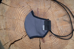 flat shot of the organic summer cotton mask in dark grey
