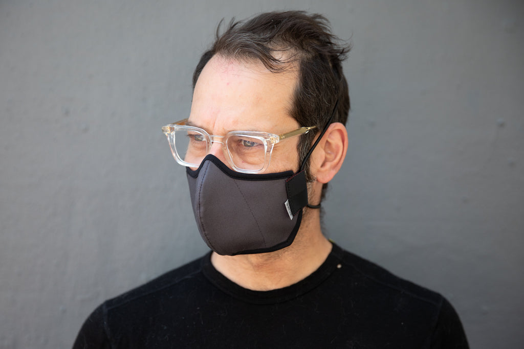Matt is wearing the organic summer cotton mask in dark grey