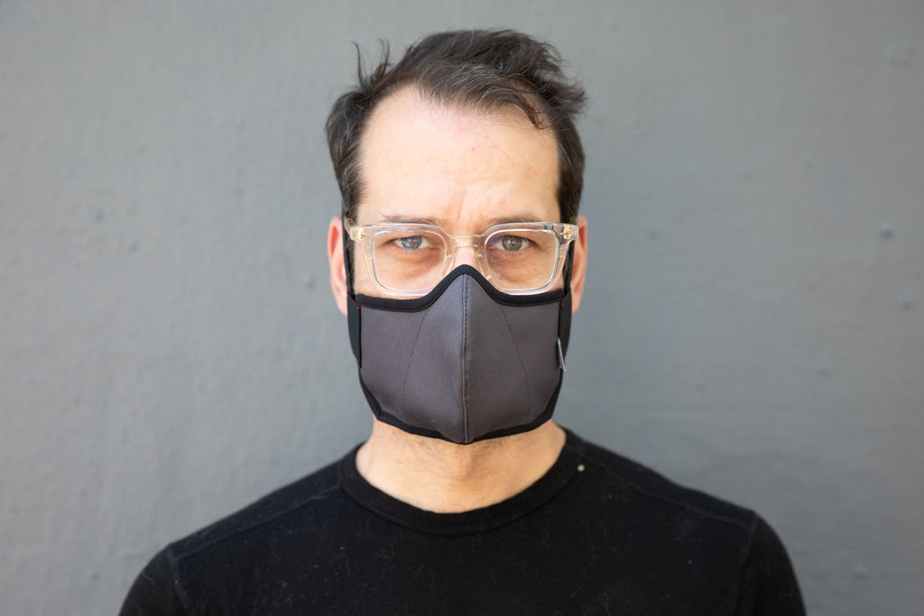 Matt is wearing the organic summer cotton mask in dark grey