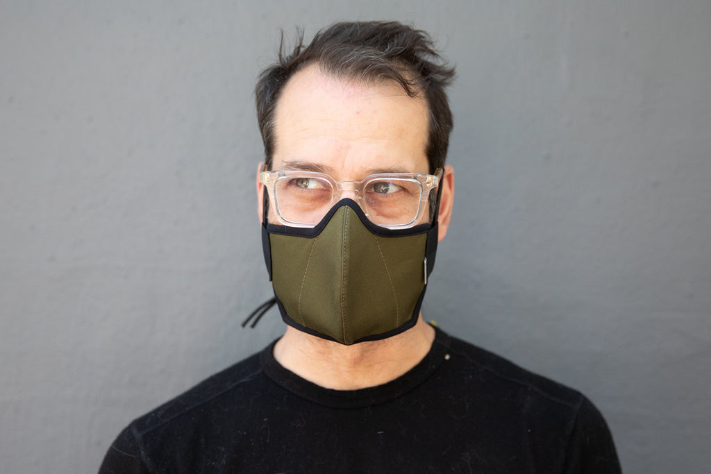 Matt is wearing the organic summer cotton mask in olive