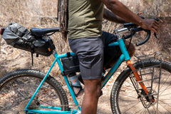 Erick is wearing the durable cotton trouser short in dark grey.