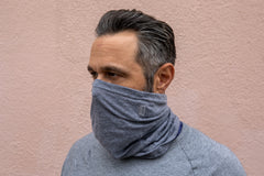 a model wearing the heather grey neck gaiter