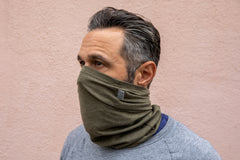a model wearing the heather pine neck gaiter