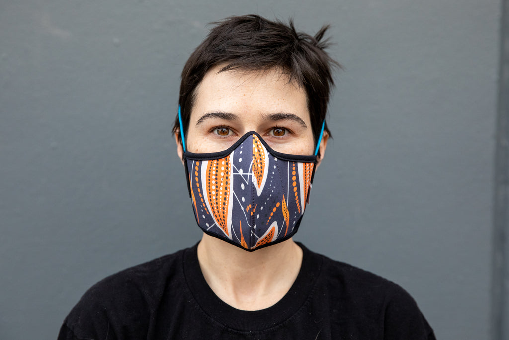 Roxy wearing the African cotton mask in cocoa pod in the adult fit