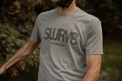Matt in a classic cotton/poly 1968 swrve logo t-shirt in grey heather.