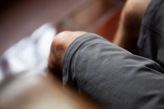 front stitching detail of the TRANSVERSE regular shorts in grey