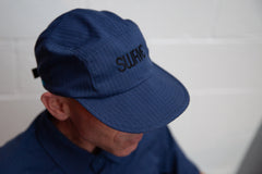 Elon wearing the swrve 1968 logo embroidered CORDURA combat wool camp hat in blue