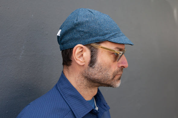 Profile shot of Matt wearing the blue heather midweight wool/silk cap