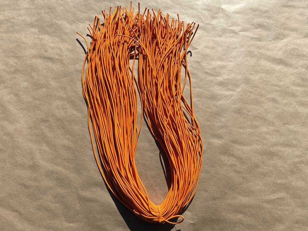 flat shot of our mask color cord in tangerine