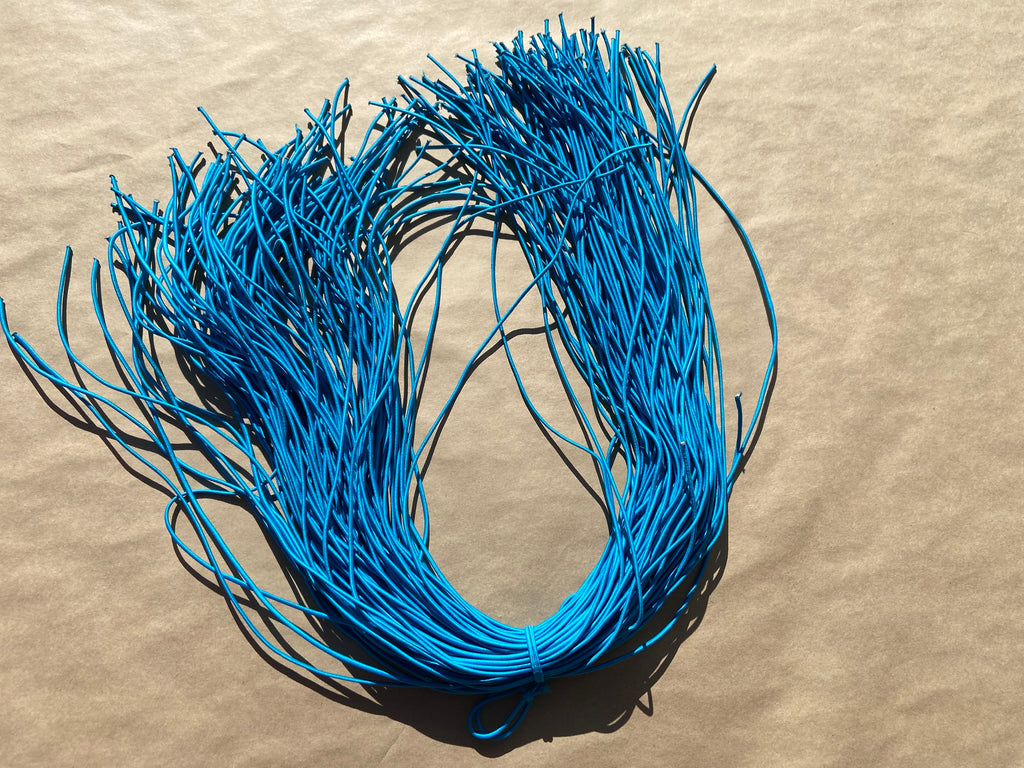 flat shot of our mask color cord in cyan